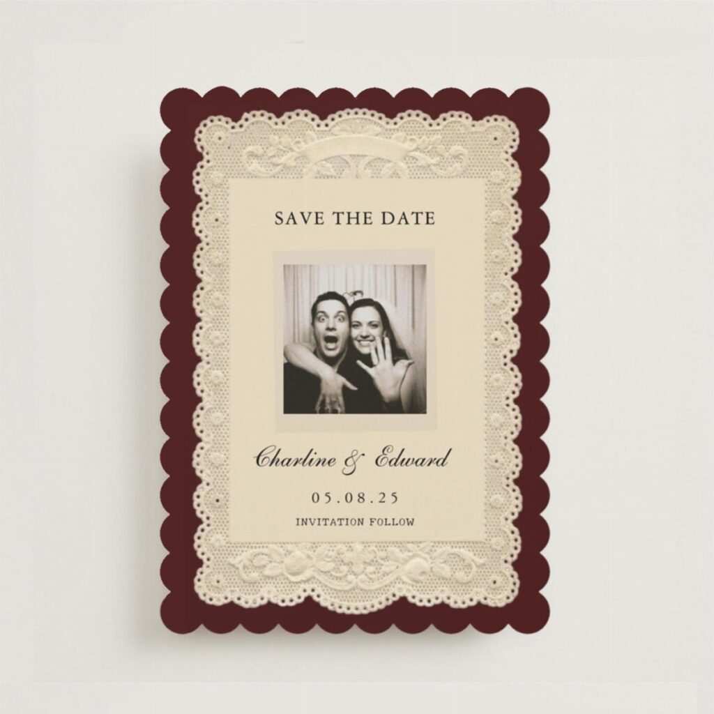 Vintage save the date card with burgundy scalloped edges, lace trim, and couple's photo.