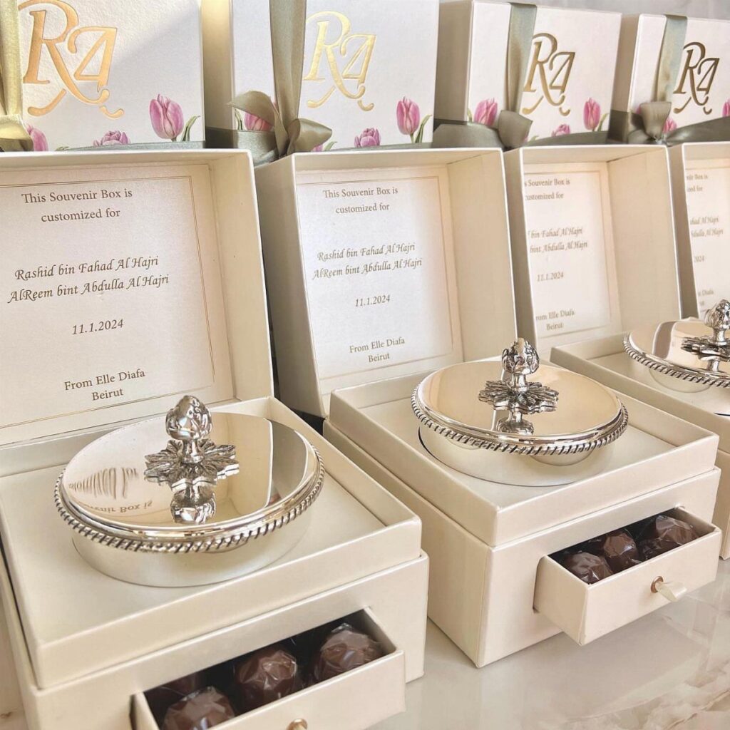 Luxury wedding favour boxes with silver bowls and chocolates in white packaging